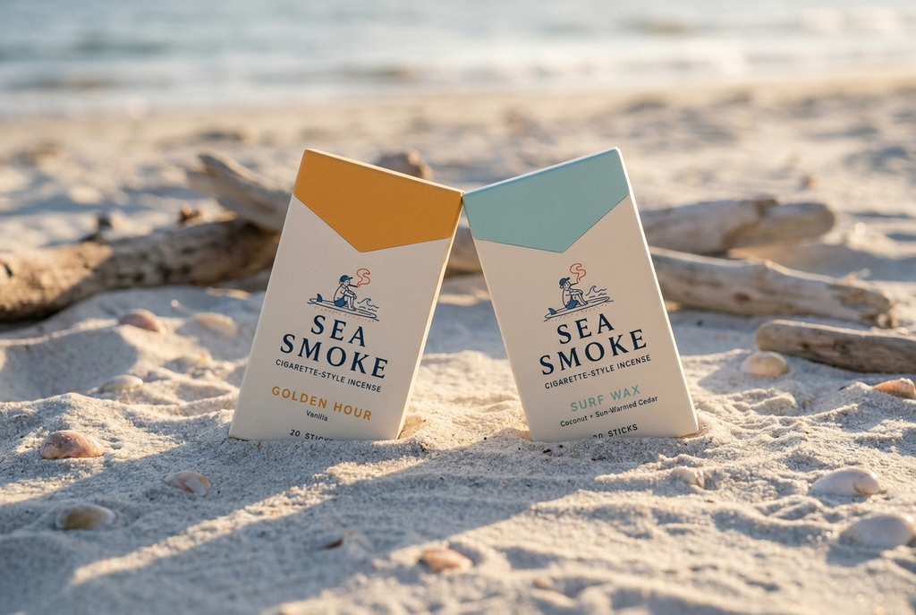 Golden Hour and Surf Wax packs leaning together in the sand at golden hour